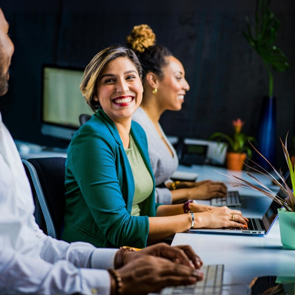 A photo of a Strategic Grants employee assisting nonprofits with grant funding.